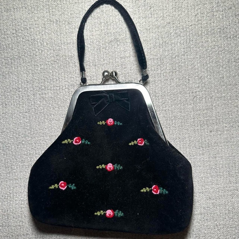 mini bag with floral detailing. vintage